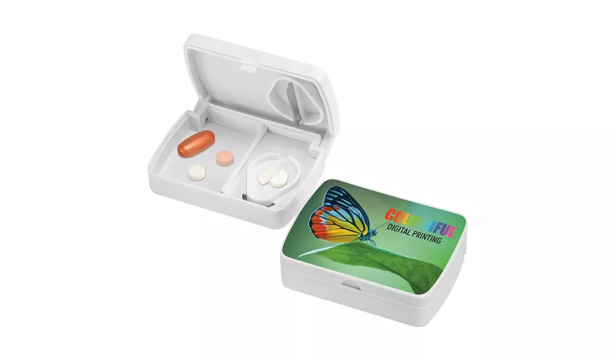 Pill box with cutter for pills - Omega